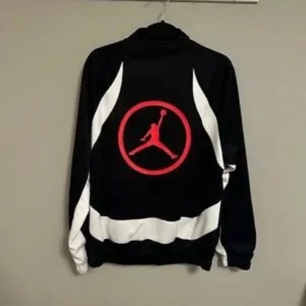 Jordan Black and White Performance Track Jacket with Red Logo